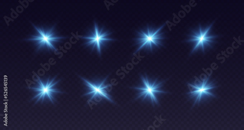 Blue lens flare, glowing star with rays, shiny flash spark, bright cosmic explosion isolated on black. Vector illustration. photo