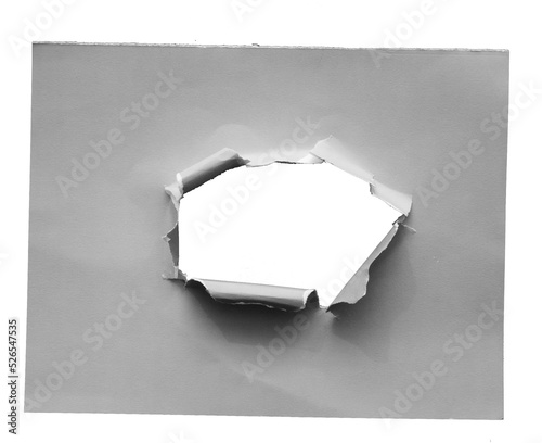 torn paper with the curled ripped sides. a round black hole of torn on the white paper. realistic torn paper with the ripped edges for copy space and text.