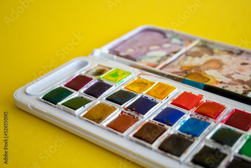 A colorful watercolor palette used for painting