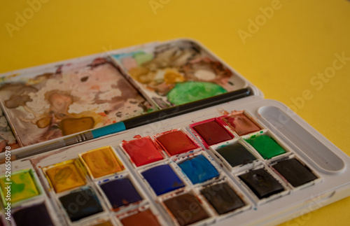 A colorful watercolor palette used for painting