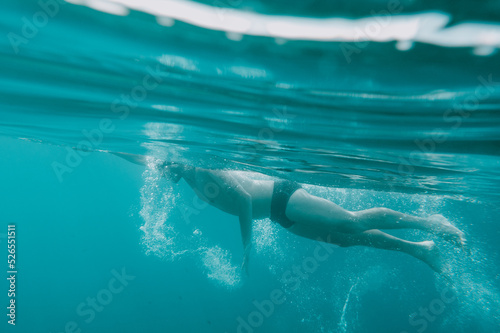 Sporty man swims fast in the sea © alphaspirit