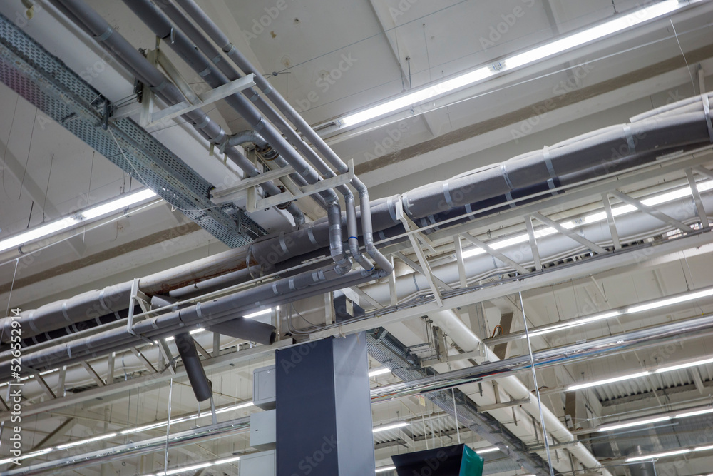 ventilation and air conditioning systems in an industrial ceiling