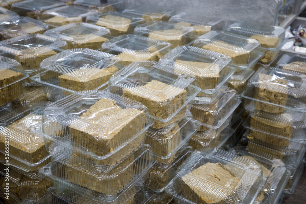 halva traditional arabic oriental sweets in portions in boxes in a