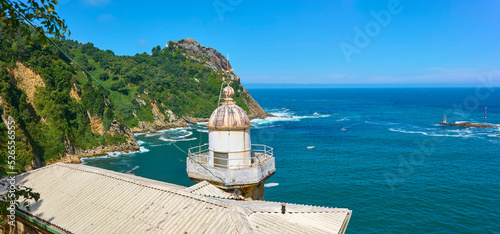 Panoramic view of the mouth of the Pasaia river, with the Cape Cabo de la Plata of the Monte Ulia in the background and the the Senokozulua lighthouse in the foreground. Puntas de San Pedro, Pasajes,  photo
