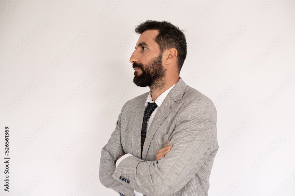Portrait of handsome bearded man. Male model in suit against white background. Portrait, studio shot concept Portrait of handsome bearded man. Male model in suit against white background. Portrait, studio shot concept