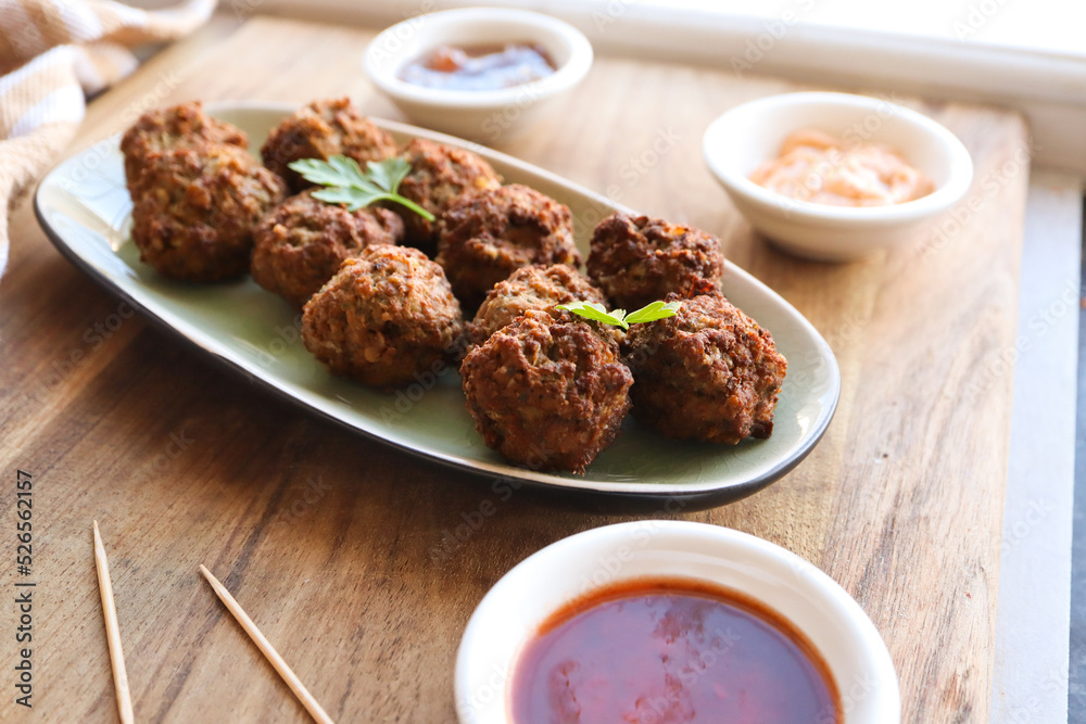 Mini beef frikkadels. Traditional South African meatballs made with mince, bread, spices, eggs and onion Mini beef frikkadels. Traditional South African meatballs made with mince, bread, spices, eggs and onion