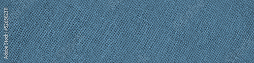Blue woven surface close up. Linen textile texture. Fabric net background. Textured braided len banner or headline. Macro