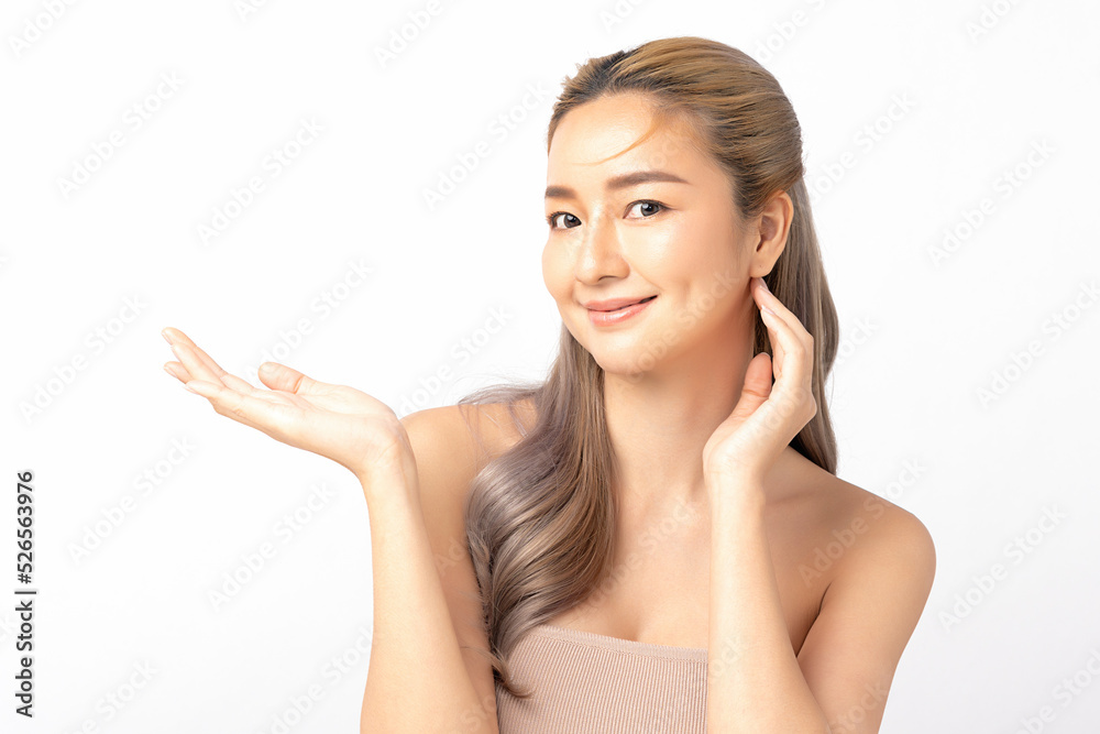 Happy beautiful asian woman looking to camera and showing empty copy space on the open hand. Asian girl beauty face skincare and health wellness, Facial treatment, Isolated on white background. Happy beautiful asian woman looking to camera and showing empty copy space on the open hand. Asian girl beauty face skincare and health wellness, Facial treatment, Isolated on white background.