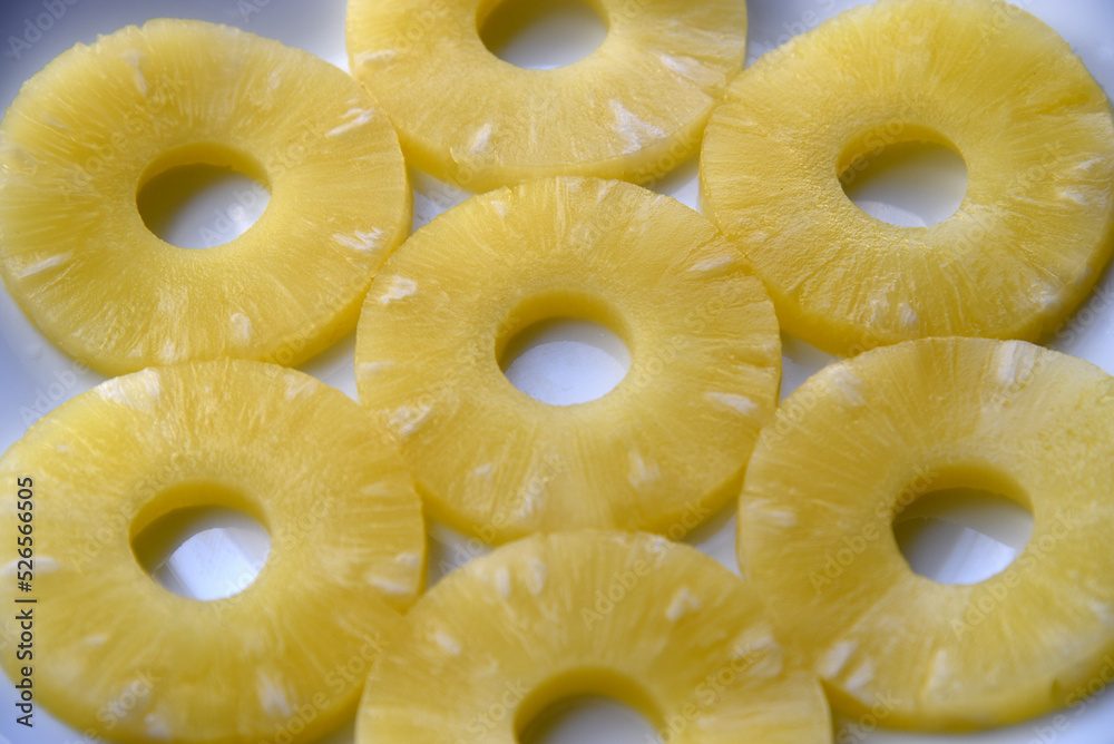 Background of pineapple rings on a plate background. Delicious breakfast of pineapple rings. Background of pineapple rings on a plate background. Delicious breakfast of pineapple rings.