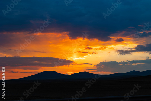 Sunset or sunrise over the mountain and cloudy sky. Inspirational background © senerdagasan