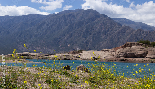 Beautiful scenery with a lake and mountains on a cloudy day.