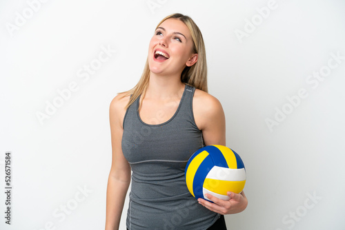 Young caucasian woman playing volleyball isolated on white background laughing