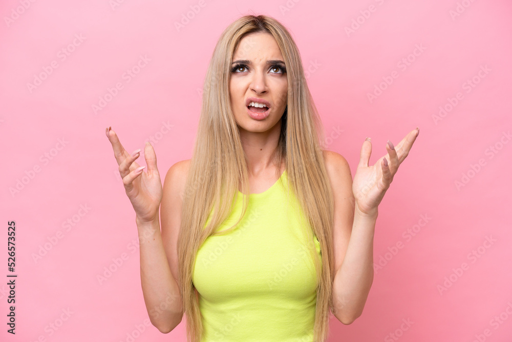 Pretty blonde woman isolated on pink background stressed overwhelmed Pretty blonde woman isolated on pink background stressed overwhelmed