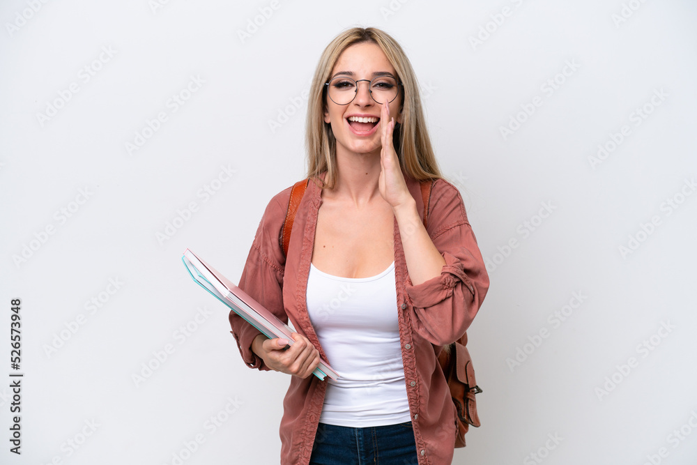 Pretty student blonde woman isolated on white background shouting with mouth wide open Pretty student blonde woman isolated on white background shouting with mouth wide open