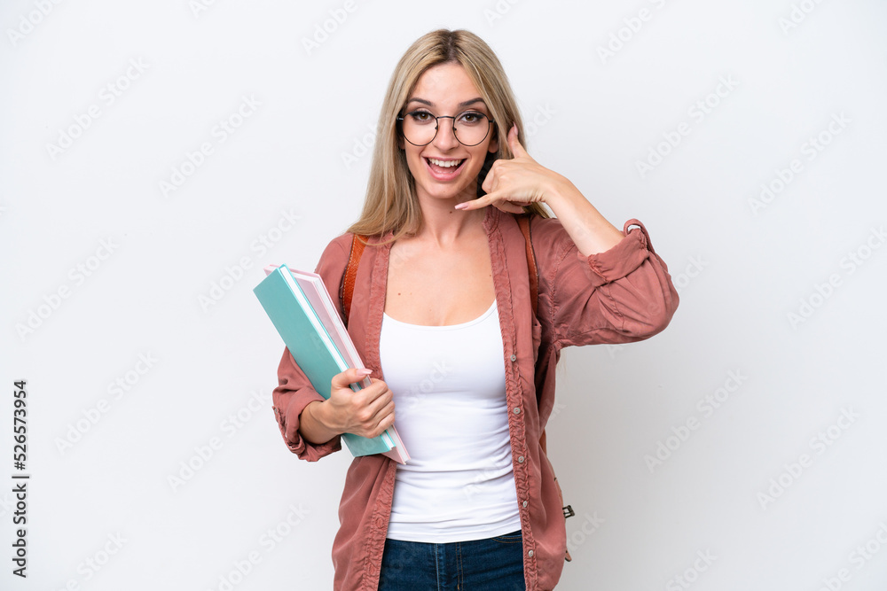 Pretty student blonde woman isolated on white background making phone gesture. Call me back sign Pretty student blonde woman isolated on white background making phone gesture. Call me back sign