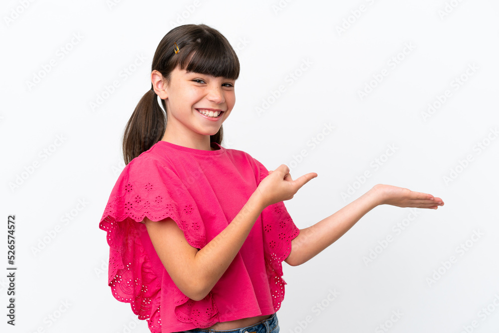 Little caucasian kid isolated on white background holding copyspace imaginary on the palm to insert an ad Little caucasian kid isolated on white background holding copyspace imaginary on the palm to insert an ad
