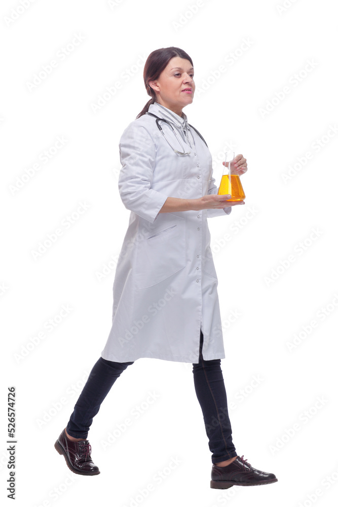 Front view of walking female scientist with beaker