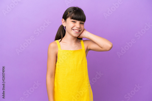 Little caucasian kid isolated on purple background laughing