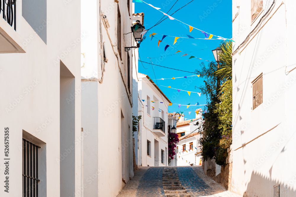 Fototapeta premium Nice street in white Mediterranean-style houses in Altea la Vella, Alicante (Spain).