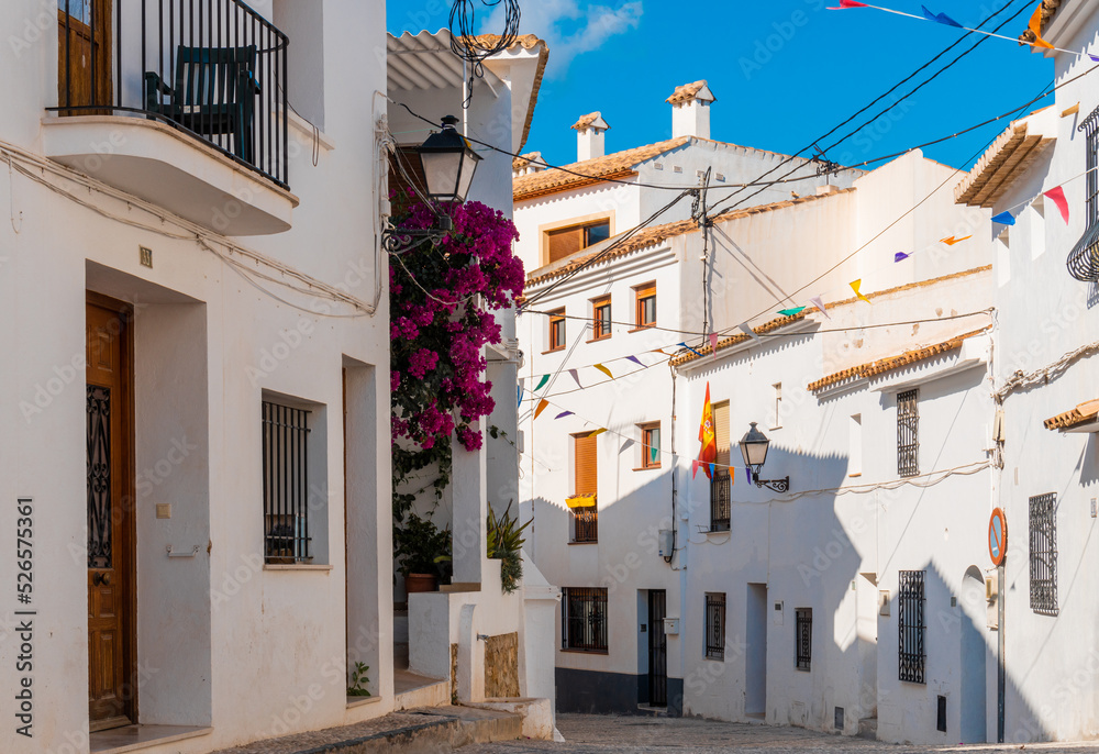 Nice street in white Mediterranean-style houses in Altea la Vella, Alicante (Spain).