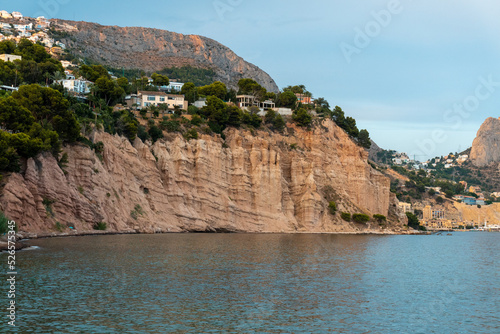 Mountainous slope worn and eroded by the rains, in a cove near the sea.