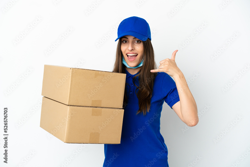 Delivery caucasian woman isolated on white background making phone gesture. Call me back sign Delivery caucasian woman isolated on white background making phone gesture. Call me back sign