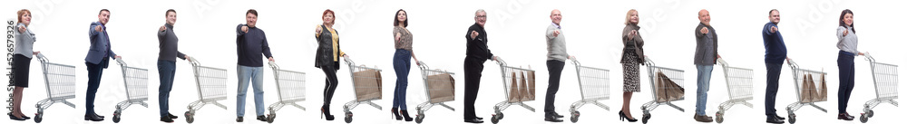 a group of people with a shopping cart point their finger at the camera a group of people with a shopping cart point their finger at the camera