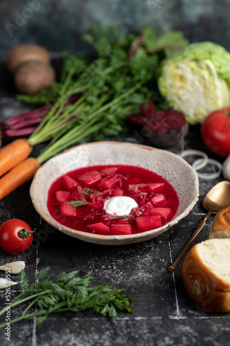 Ukrainian borsch with ingredients. Fresh peeled vegetables and ribs, ingredients for borsch soup. banner, menu, recipe.