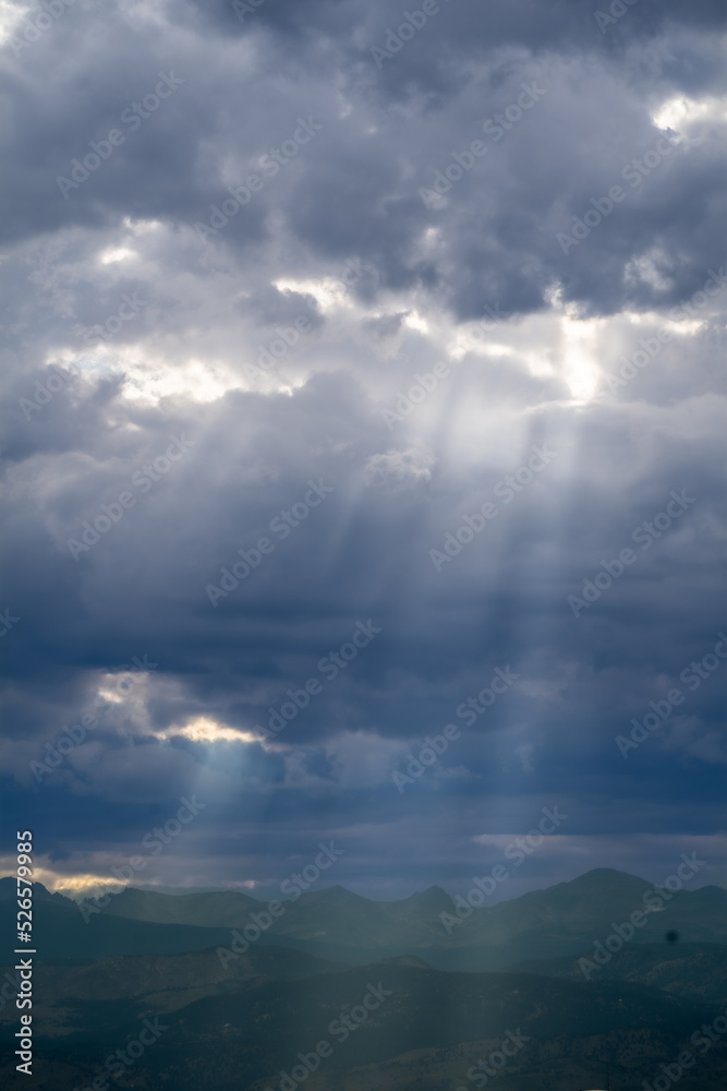 Sun rays through the clouds in Colorado, USA Sun rays through the clouds in Colorado, USA