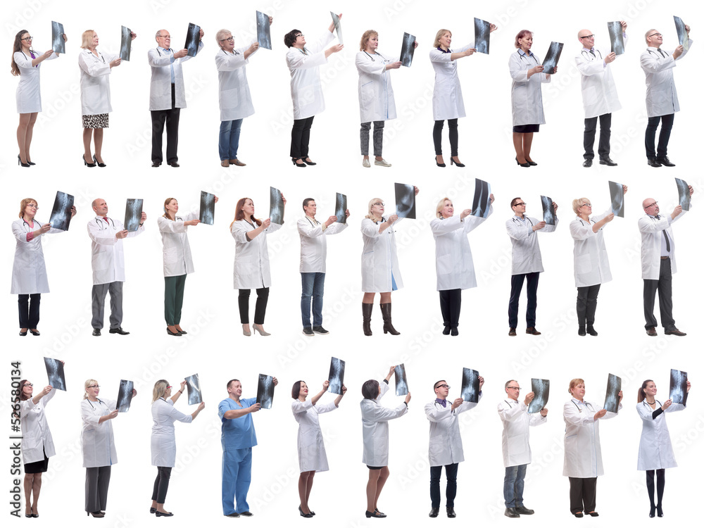 group of doctors holding x-ray isolated on white