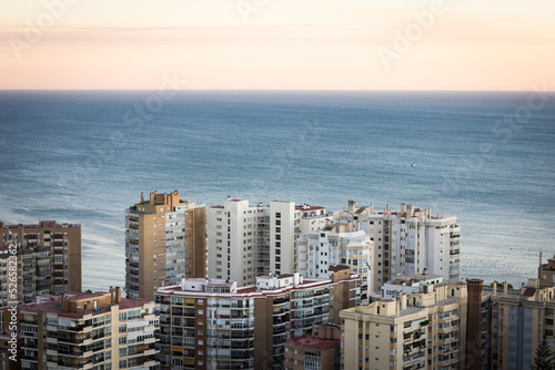 Málaga, Spain, cityscape with sea on a sunset