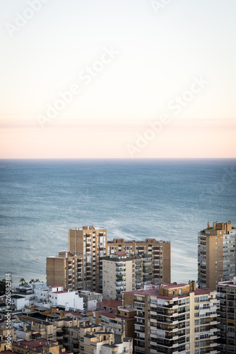 Málaga, Spain, cityscape with sea on a sunset