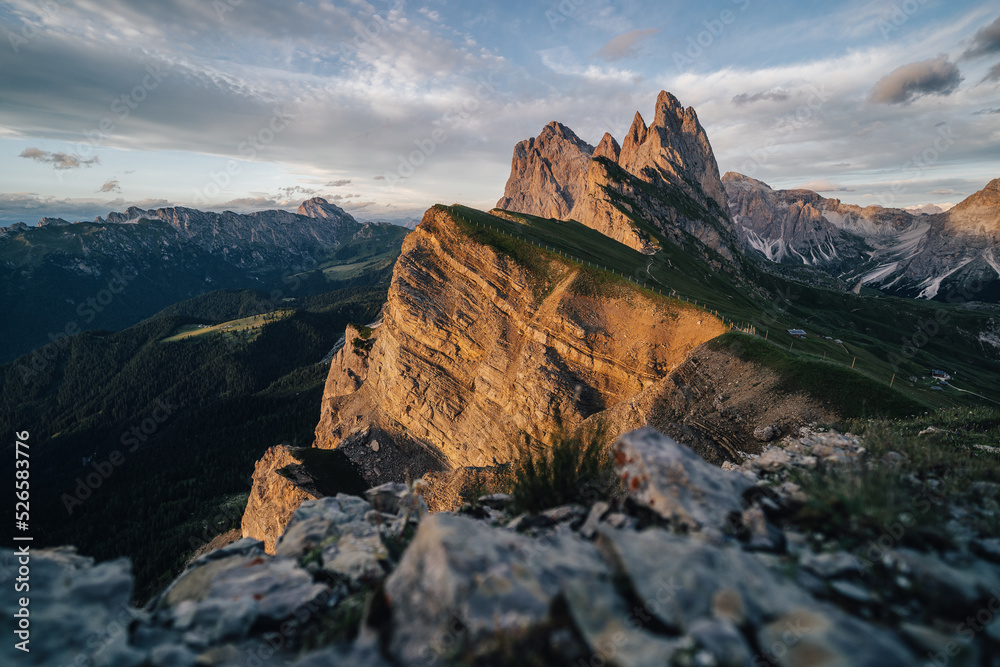 Amazing views of the Dolomites mountain landscape. Sunset view from Seceda over to the Odle mountains. Spectacular dolomitean landscape, Tyrol, Italy.