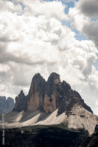 Dramatic view of Tre Cime di Lavaredo (Drei Zinnen), Dolomity, South Tyrol, Italy. Famous rock formation Tre Cime. High alpine rock faces in Dolomite landscape. © Ondra