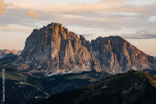 Sunset photo of Sassolungo and Sassopiato (Langkofel) mountian in Dolomites, Tyrol, Italy. High rock face in Dolomiti. Sunset over the alpine mountain landscape. © Ondra