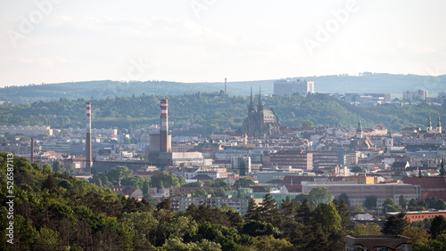 Brno city skyline and Petr and Pavel  Petr and Paul s  cathedral with chimneys around it. A view from Hady quarry.