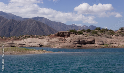 Beautiful scenery with a lake and mountains on a cloudy day.