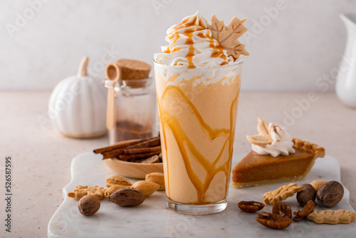 Fotografia, Obraz Pumpkin pie milkshake with caramel syrup and whipped cream
