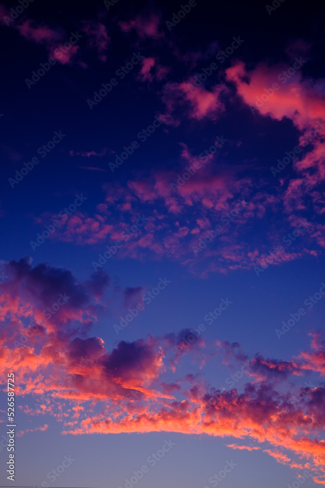 Colorful sky with light cirrus clouds during sunset.
