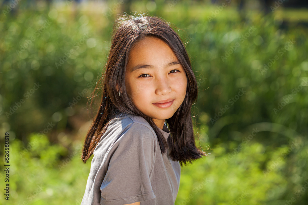 Portrait of a young beautiful girl in summer park Portrait of a young beautiful girl in summer park