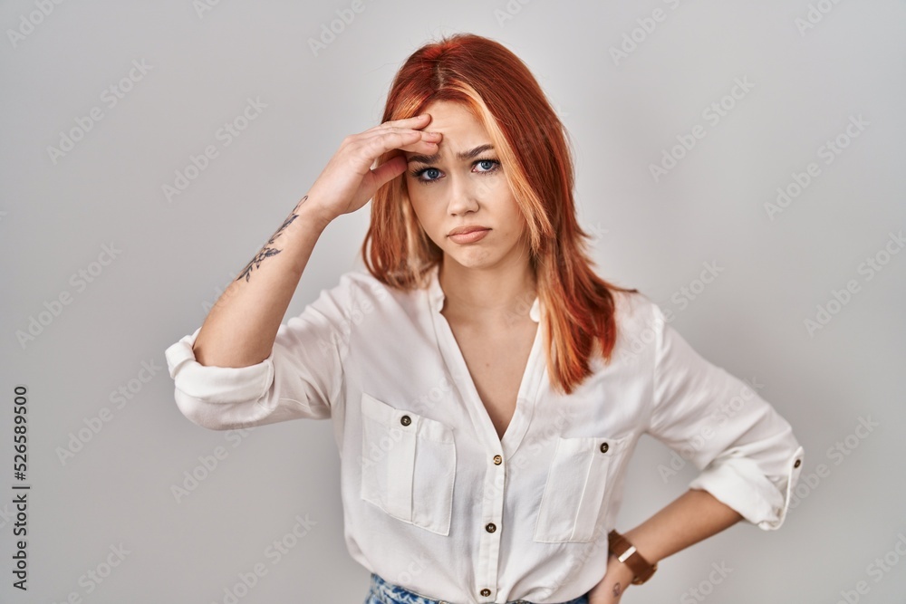 Young caucasian woman standing over isolated background worried and stressed about a problem with hand on forehead, nervous and anxious for crisis Young caucasian woman standing over isolated background worried and stressed about a problem with hand on forehead, nervous and anxious for crisis