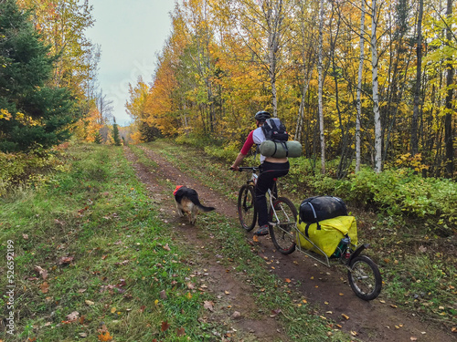 Bike Packing with gear and dog on ATV trails in the fall