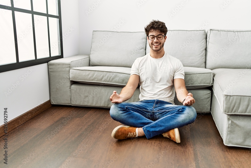 Young hispanic man smiling confident doing yoga exercise at home Young hispanic man smiling confident doing yoga exercise at home