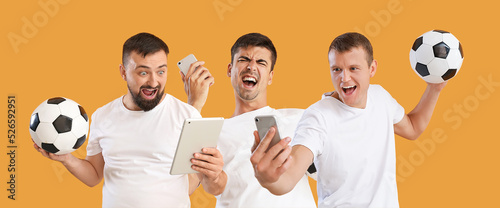 фотографія Collage of happy men with soccer balls, mobile phones and tablet computer on ora