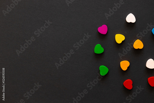 Colored figures in the form of heart on a black background