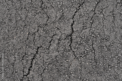 Surface of new clean cracked asphalt. Top view.