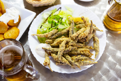 Closeup of fried anchovies food with sauce. High quality photo