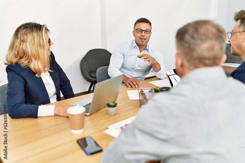 Group of middle age business workers working at the office. Group of middle age business workers working at the office.