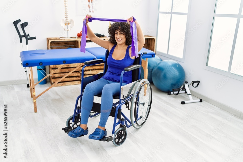 Young middle east woman doing rehab sitting on wheelchair at clinic Young middle east woman doing rehab sitting on wheelchair at clinic