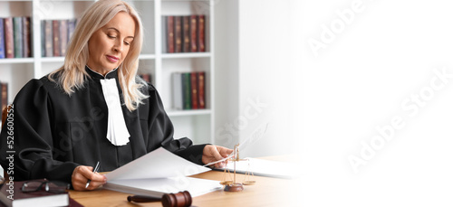 Mature female judge working...
